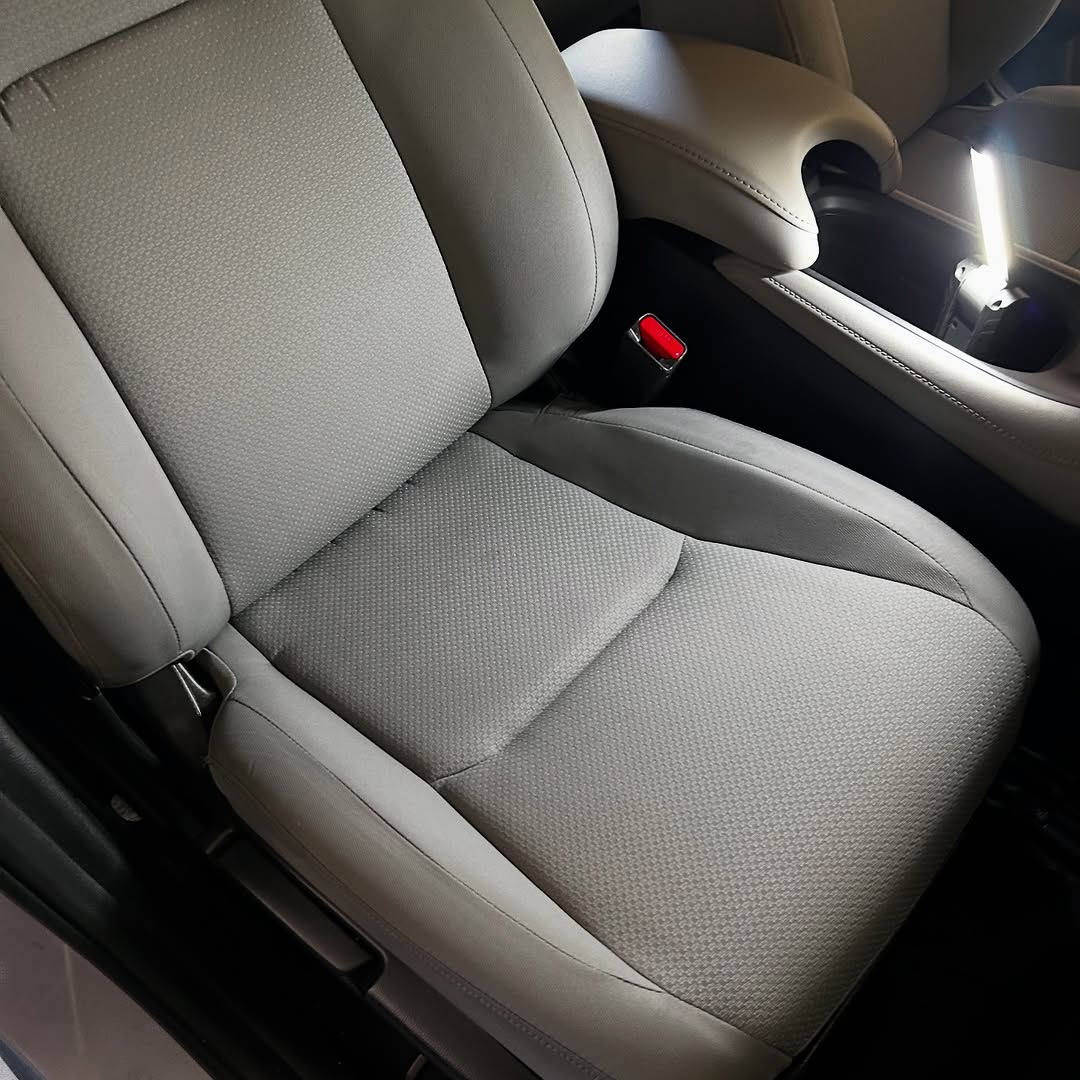 Interior auto detailing showing clean seats and dashboard